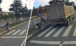 Kütahya'da kadın ve çocuk yaya geçidinde az kalsın eziliyordu